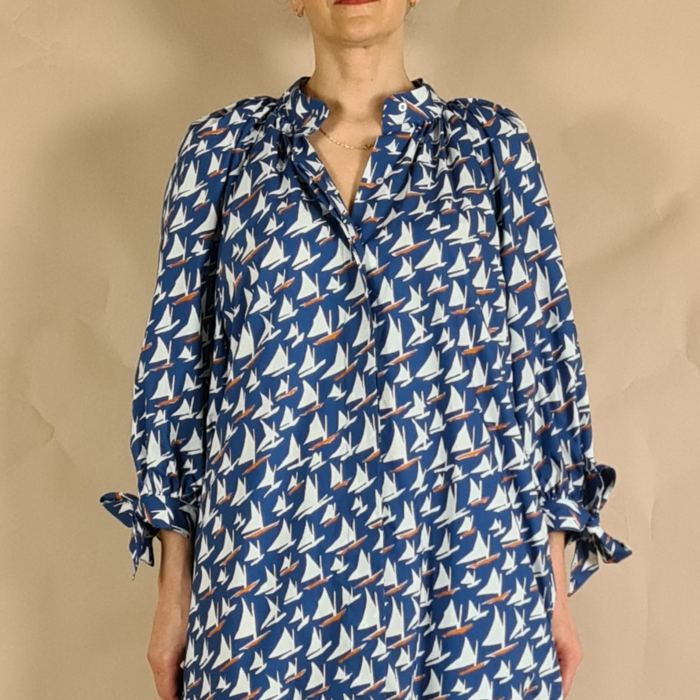 Model wearing boat print summer puff sleeve blouse with gathered neck
