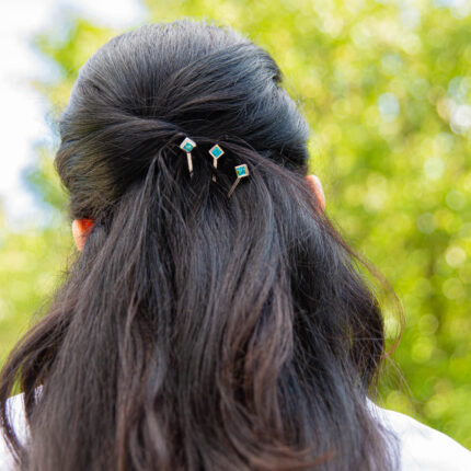 ‘Hairloom’ hair slider with a square Ostro Blue Topaz set in Sterling Silver being worn by model