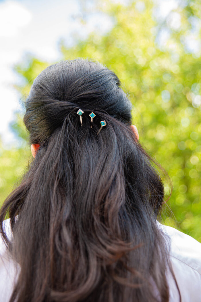 ‘Hairloom’ hair slider with a square Ostro Blue Topaz set in Sterling Silver being worn by model