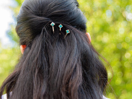 ‘Hairloom’ hair slider with a square Ostro Blue Topaz set in Sterling Silver being worn by model