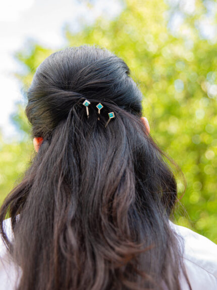 ‘Hairloom’ hair slider with a square Ostro Blue Topaz set in Sterling Silver being worn by model