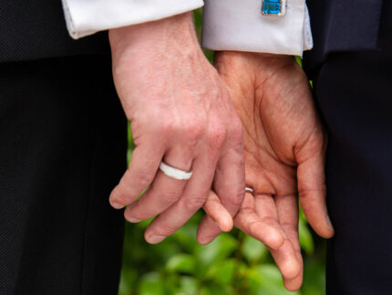 A modern couple wearing our ‘Off the Cuff’ octagon and cushion cufflinks along with the ‘Hidden Gem’ ring for him
