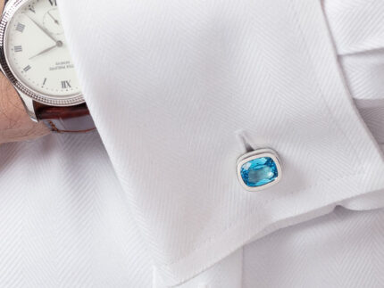 ‘Off the Cuff’ cushion cufflinks with a pair of cushion Ostro Blue Topaz set in sterling silver being worn by model