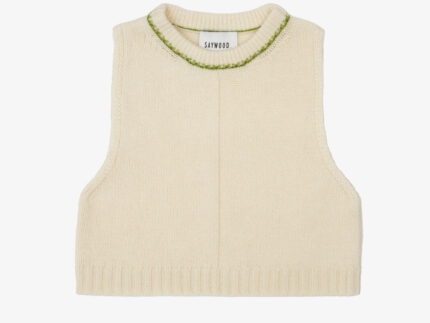 Cream sleeveless lambswool knitted vest with moss green trim on white background. Saywood's Ada Sweater Vest, handcrafted in the UK with Scottish-spun yarn.