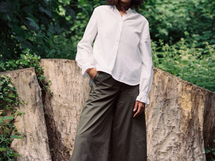 Marie white A-line blouse with red check neckerchief, made in London by Saywood. Worn with Amelia khaki wide leg trousers.