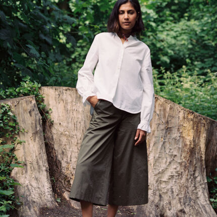 Marie white A-line blouse with red check neckerchief, made in London by Saywood. Worn with Amelia khaki wide leg trousers.