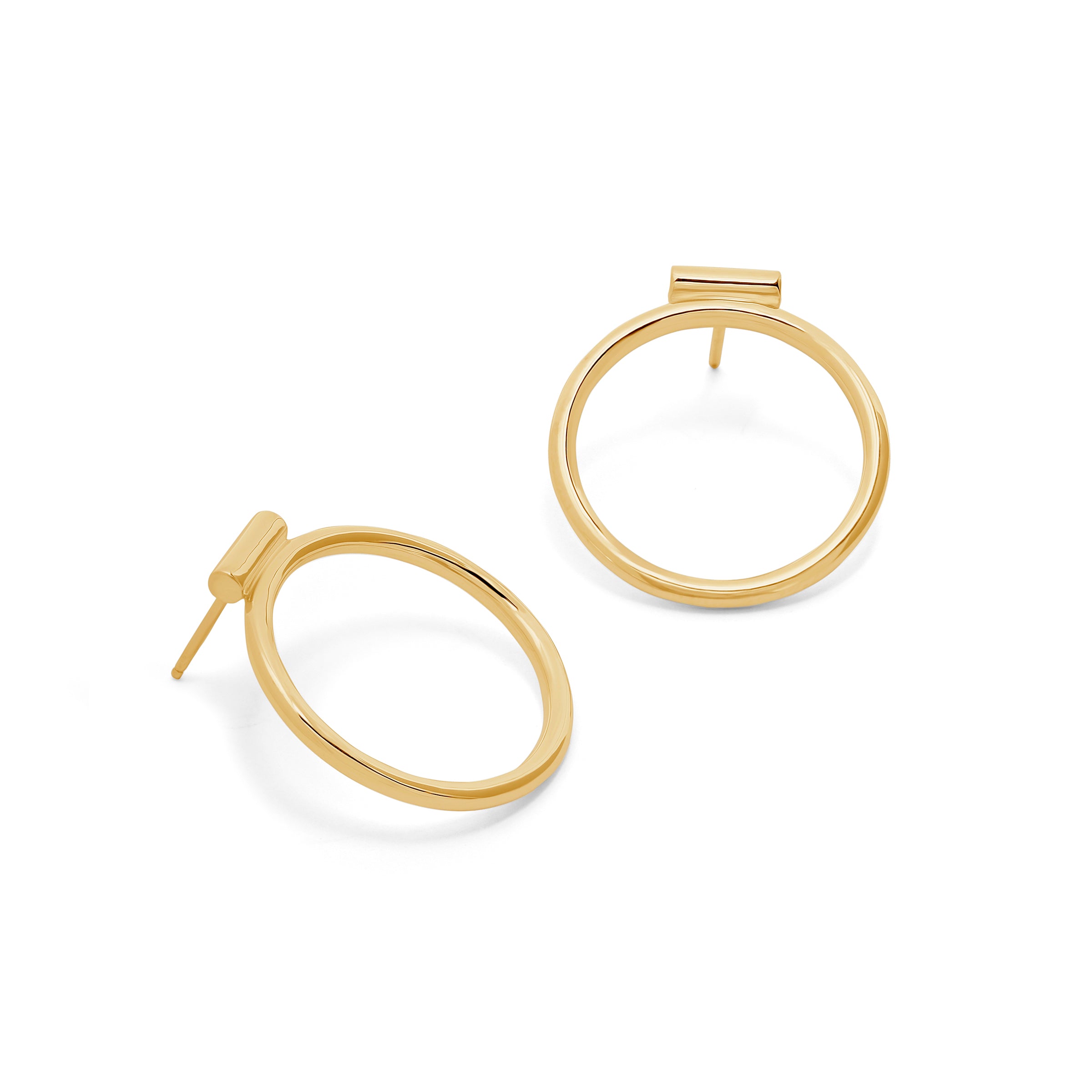 Gold hoop earrings on a white background