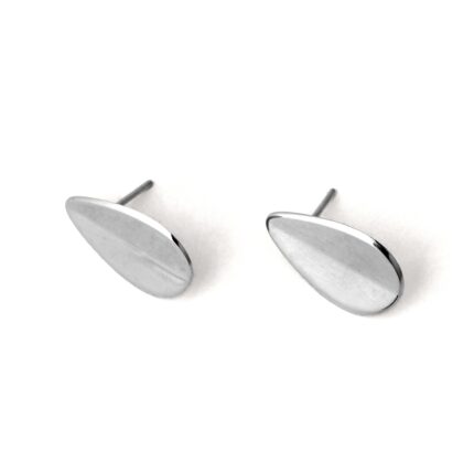 A pair of silver-colored teardrop-shaped earrings with a folded concavity design, displayed against a white background.