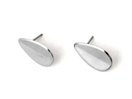 A pair of silver-colored teardrop-shaped earrings with a folded concavity design, displayed against a white background.