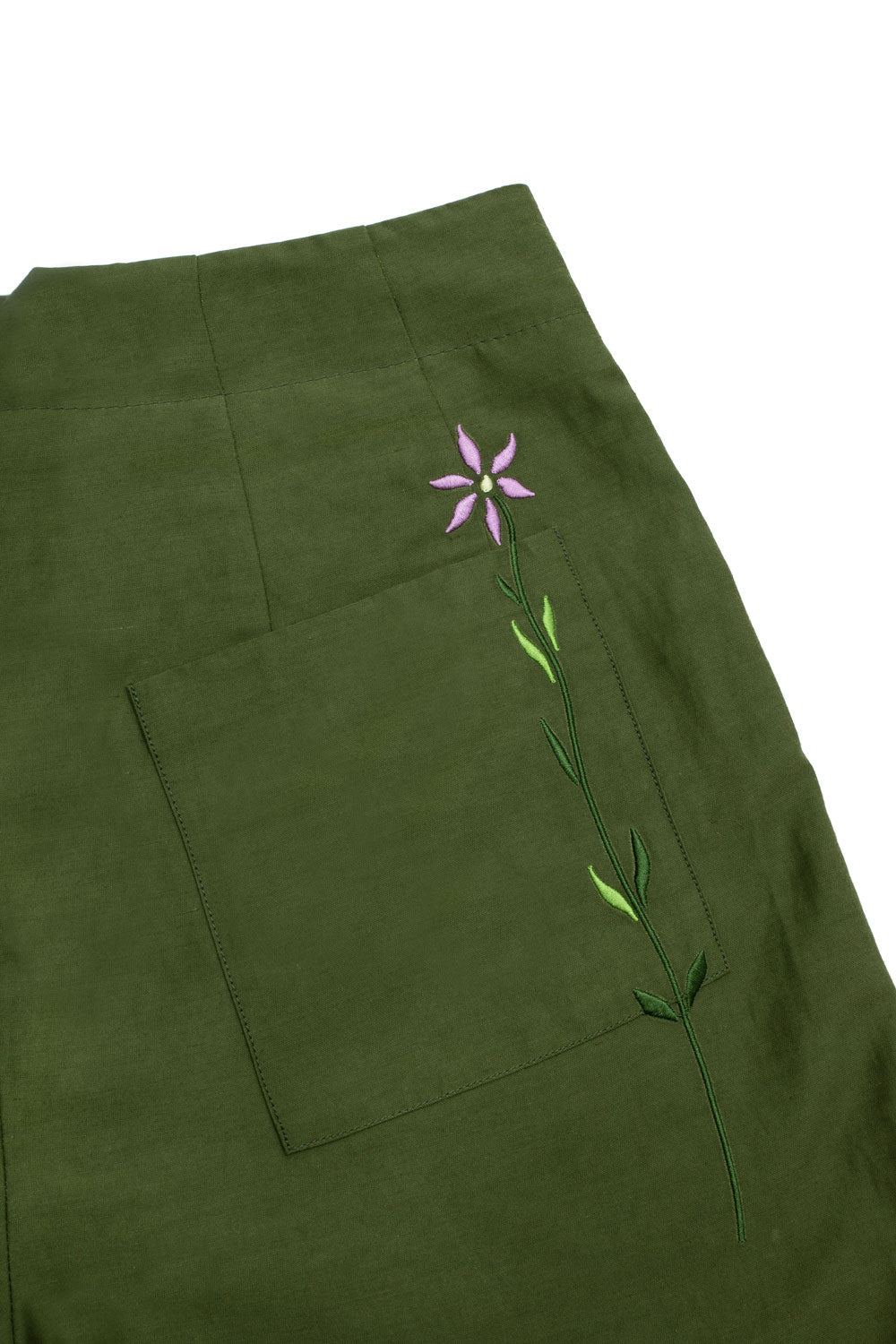 Close-up of Bessie shorts back pocket with embroidered flower detail and tailored darts in olive green by Saywood