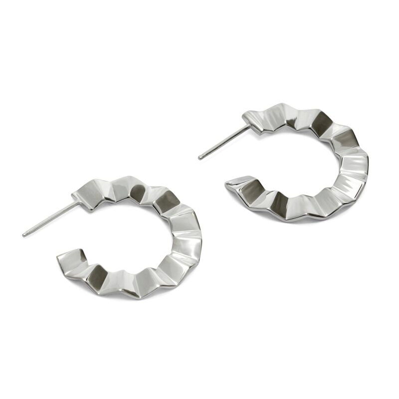 Pair of silver hoop earrings with geometric design on a white background