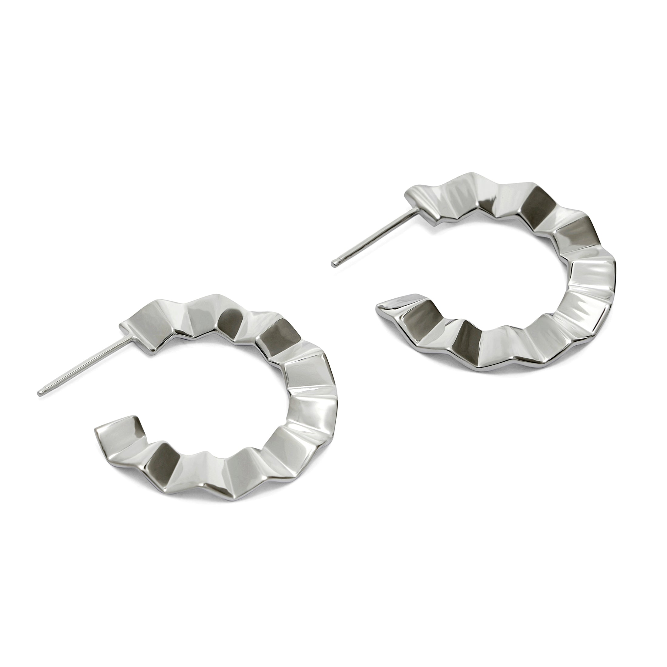 Pair of silver hoop earrings with geometric design on a white background