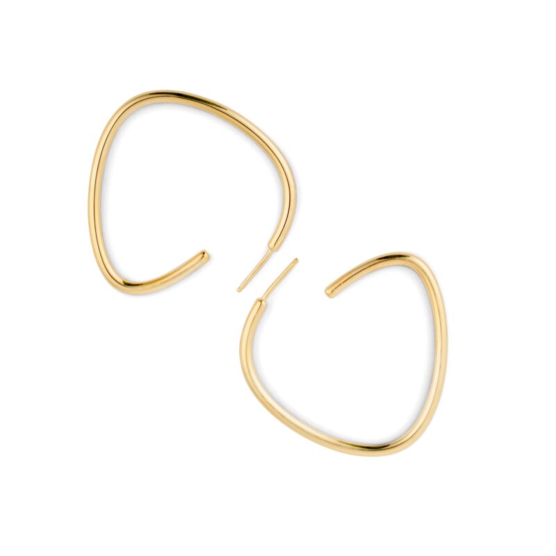 A pair of gold-colored curved hoop earrings against a white background.