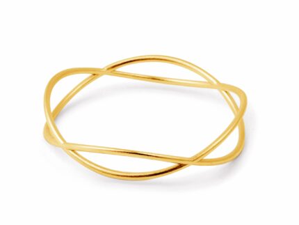 A gold-colored bracelet with a curving wave design, displayed against a white background