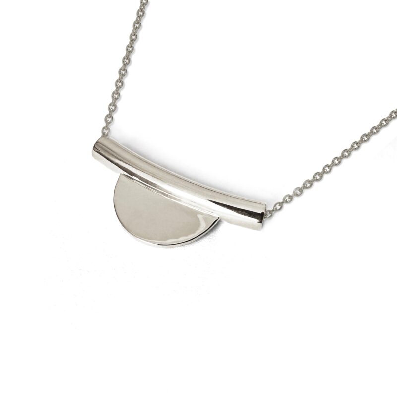 Silver necklace with a pendant on a white background