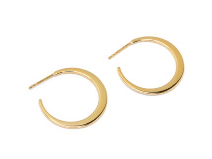 Gold hoop earrings on a white background