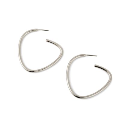 A pair of silver-colored curved hoop earrings against a white background.