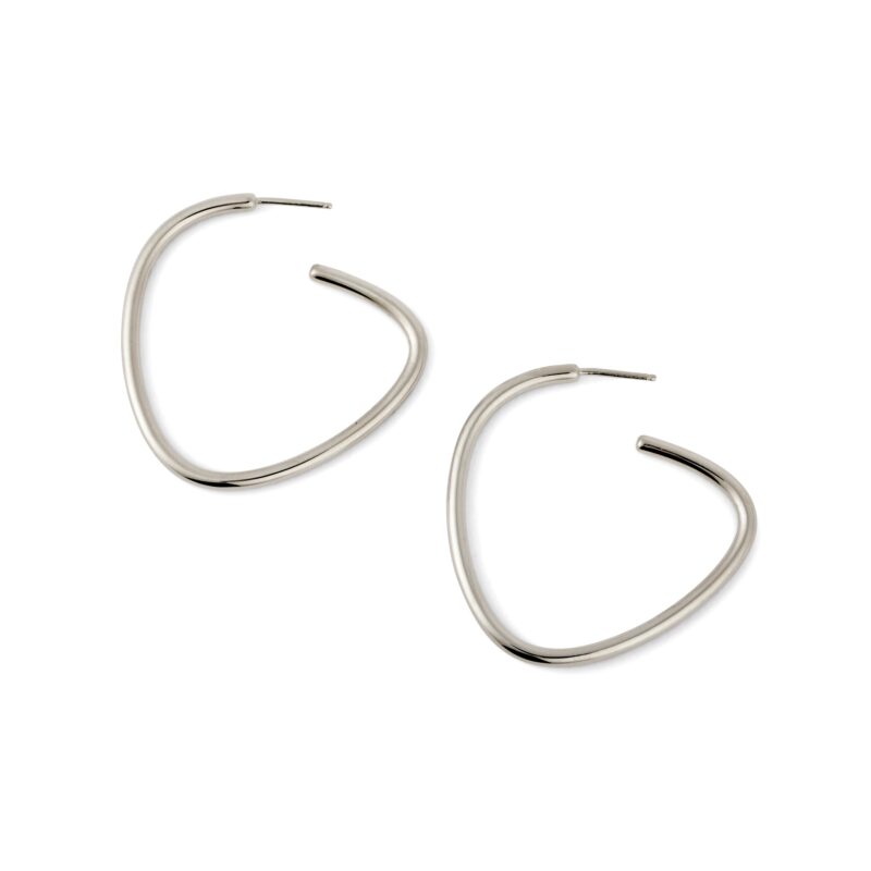 A pair of silver-colored curved hoop earrings against a white background.