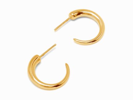 Gold hoop earrings on a white background