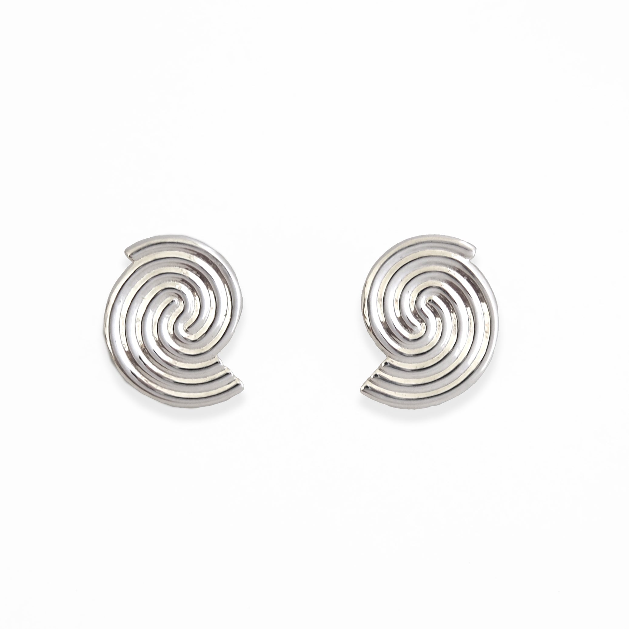 Pair of silver spiral earrings on a white background