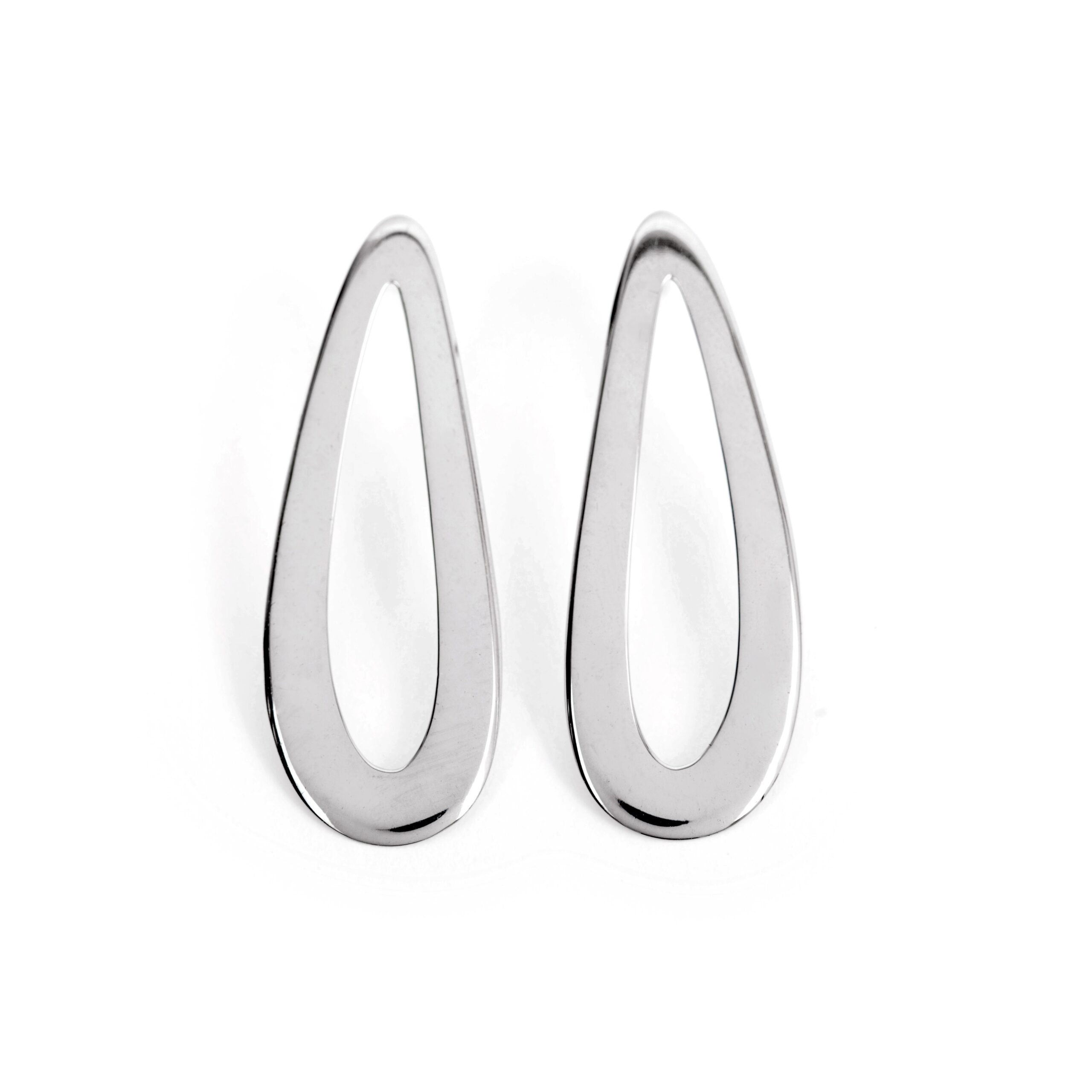 A pair of silver-colored curved drop hoop earrings on a white background