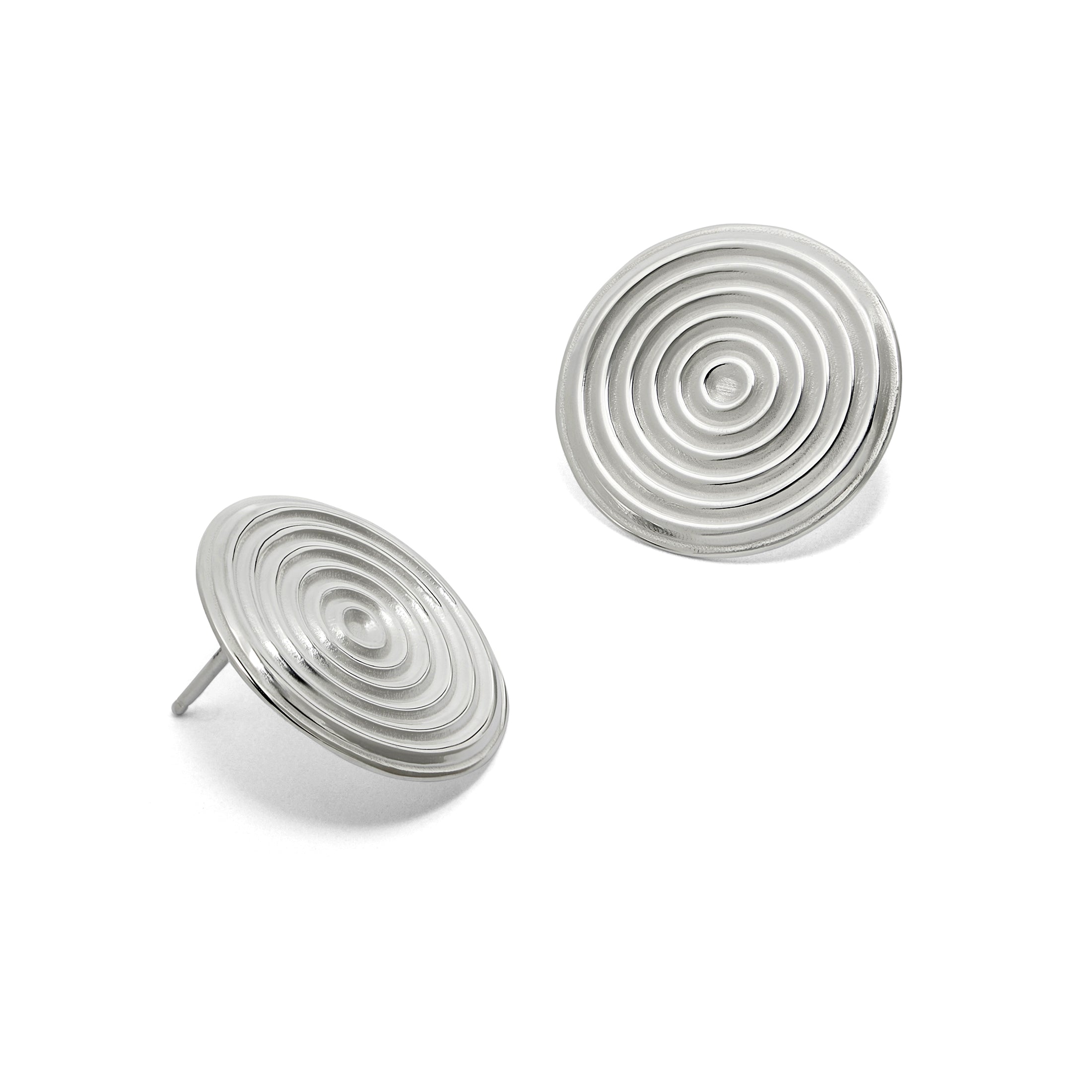 Pair of silver spiral earrings on a white background